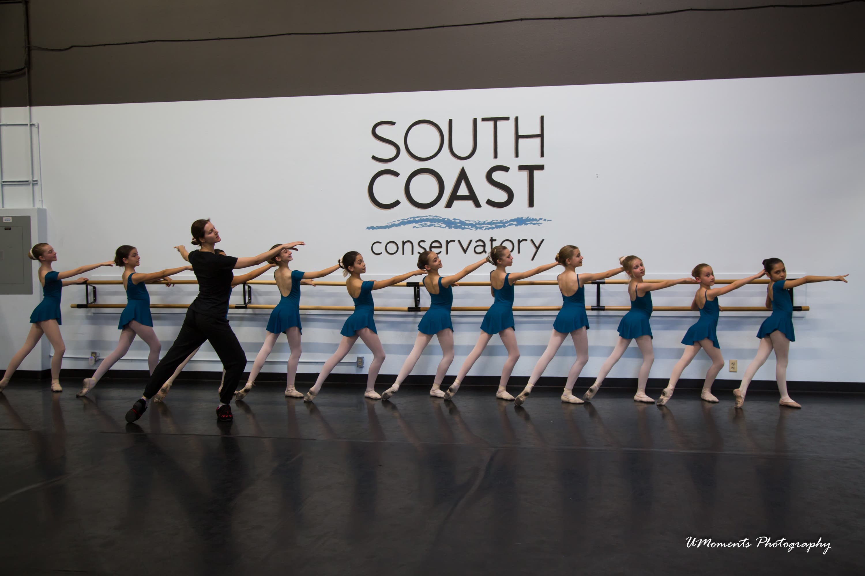 Dance students practicing in a studio line
